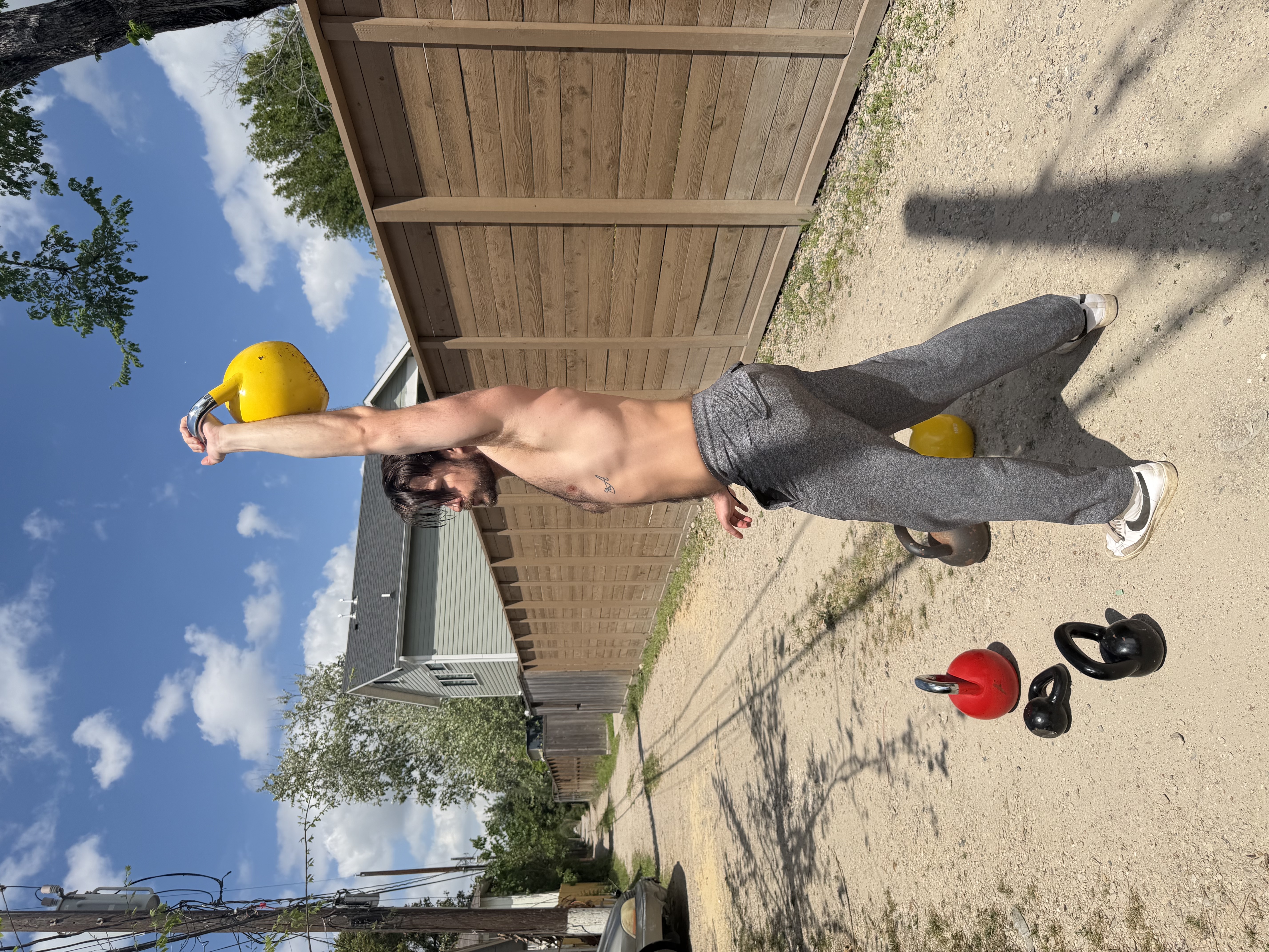 Overhead kettlebell press outdoors